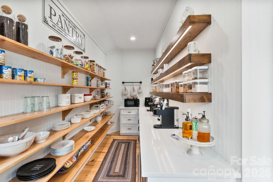 Thoughtfully designed walk in pantry features beverage fridge and ice maker Thoughtfully designed walk in pantry features beverage fridge and ice maker