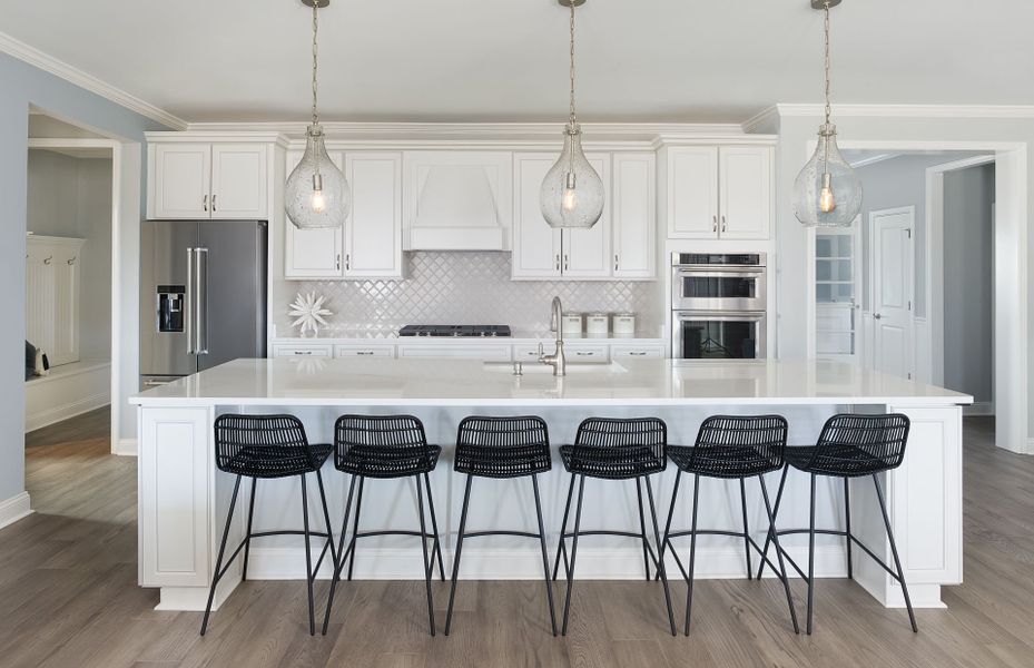 Open Kitchen with a tray ceiling and a large island providing space for extra seating. Open Kitchen with a tray ceiling and a large island providing space for extra seating.