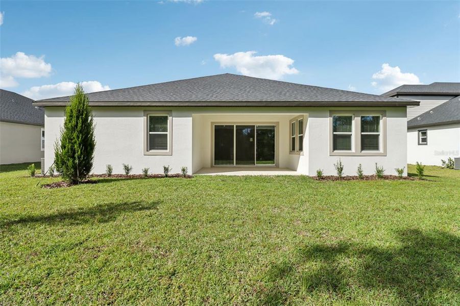 Exterior details and patio area of a home in Ridgehaven - Reserve Series, Ormond Beach (Image 21).