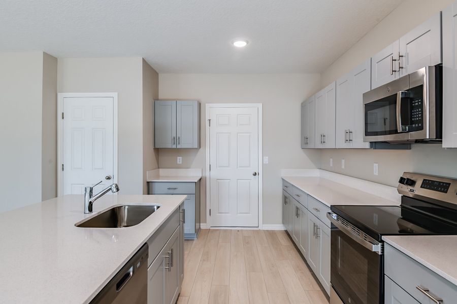 Furnished interior view inside a new home in Pasadena Ridge, Dade City (Image 3).