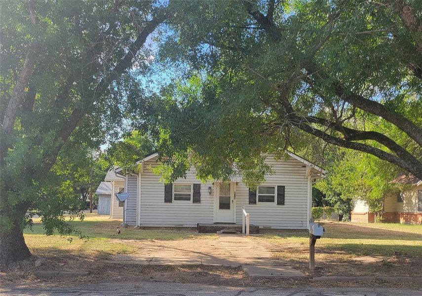 View of front of property with a front lawn