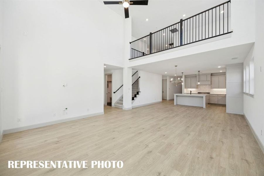 Our Versailles III plan features a game room with open railing that overlooks the family room below creating a multi-level entertainment area!  REPRESENTATIVE PHOTO