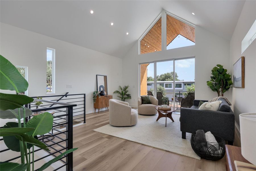 SOARING vaulted ceiling with multiple natural light sources make this living room refined and cozy. NO CARPET. SOARING vaulted ceiling with multiple natural light sources make this living room refined and cozy. NO CARPET.