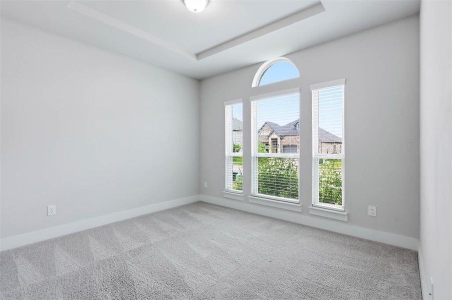 Additional bedroom or study with natural light, neutral flooring, and flexible space for guests, family, or a home office.