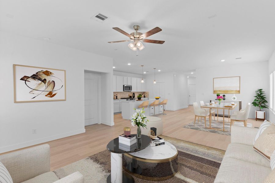 Enjoy the spacious family room filled with natural light and wood-like luxury vinyl plank flooring that adds both comfort and style. There’s plenty of room for your favorite furniture and décor!  Virtual staged