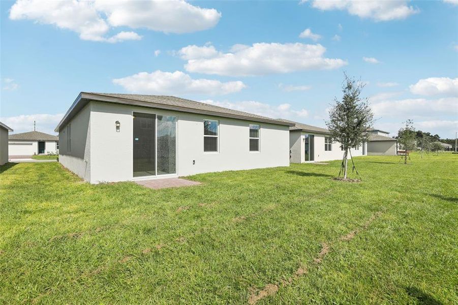 Exterior details and patio area of a home in Lawson Dunes - Signature Series, Haines City (Image 27).