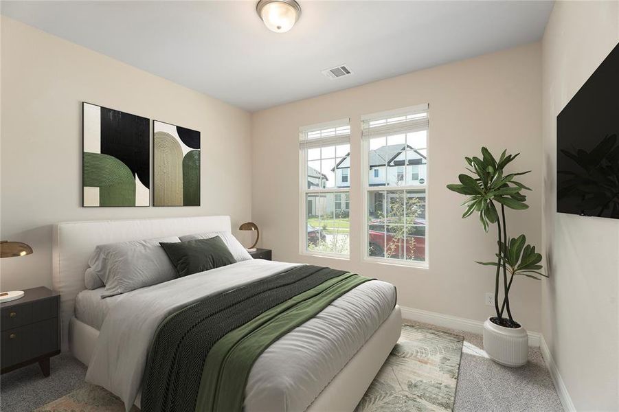 Bedroom with carpet floors and baseboards