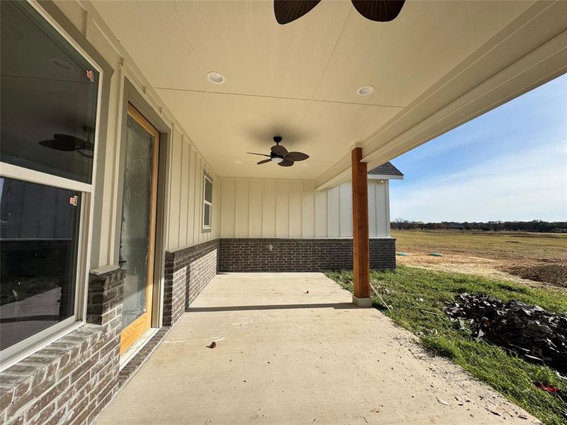 View of patio featuring ceiling fan