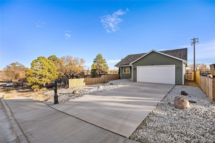 Front exterior of a new home in , Pueblo, CO, highlighting curb appeal (Image 26).