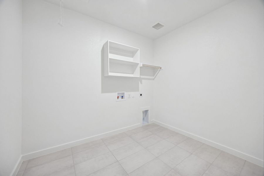 Utility Room in the Heisman home plan by Trophy Signature Homes – REPRESENTATIVE PHOTO