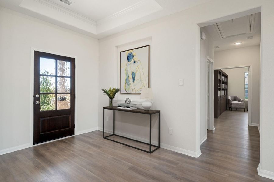 This bright and inviting living area features an open-concept layout that flows seamlessly into the kitchen and dining spaces. Neutral tones, recessed lighting, and wide-plank flooring create a modern yet comfortable atmosphere, while large windows fill the room with natural light, making it the perfect space for relaxing or entertaining family and friends. This bright and inviting living area features an open-concept layout that flows seamlessly into the kitchen and dining spaces. Neutral tones, recessed lighting, and wide-plank flooring create a modern yet comfortable atmosphere, while large windows fill the room with natural light, making it the perfect space for relaxing or entertaining family and friends.