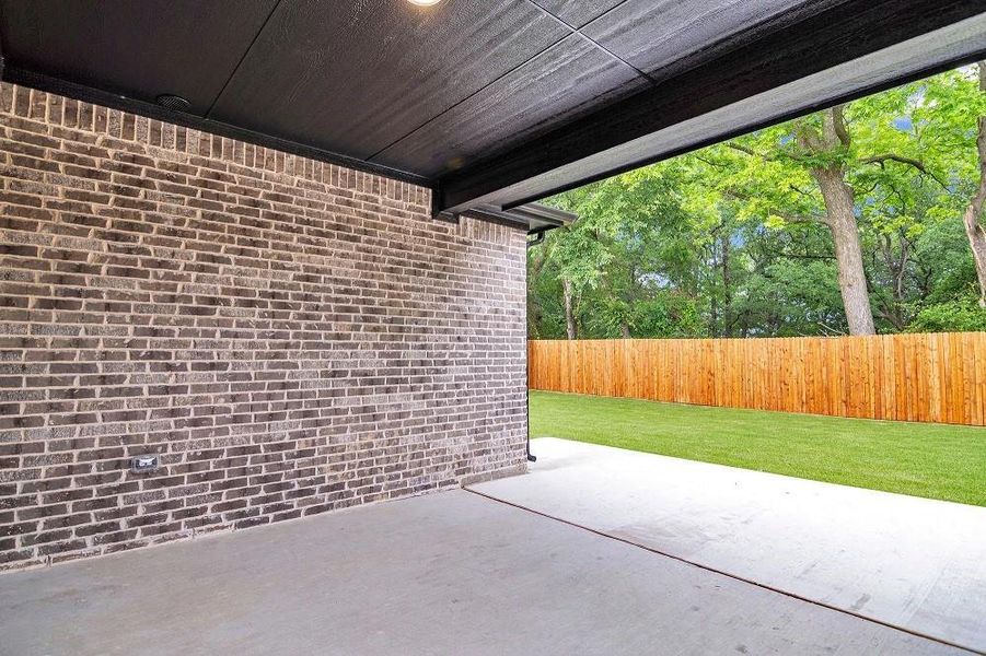 Fenced backyard with a patio Fenced backyard with a patio