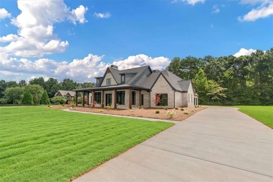 Front exterior of a new home in , Carrollton, GA, highlighting curb appeal (Image 31).