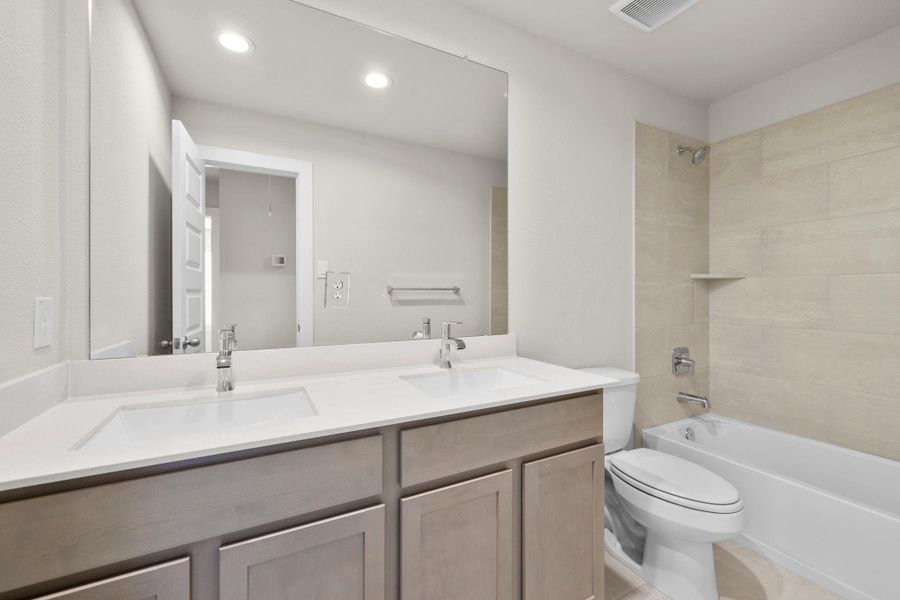 Furnished interior view inside a new home in Barton Creek Ranch, Conroe (Image 15).