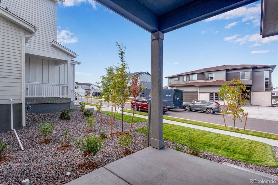 Front exterior of a new home in Wild Oak at The Canyons, Castle Pines, CO, highlighting curb appeal (Image 23). Front exterior of a new home in Wild Oak at The Canyons, Castle Pines, CO, highlighting curb appeal (Image 23).