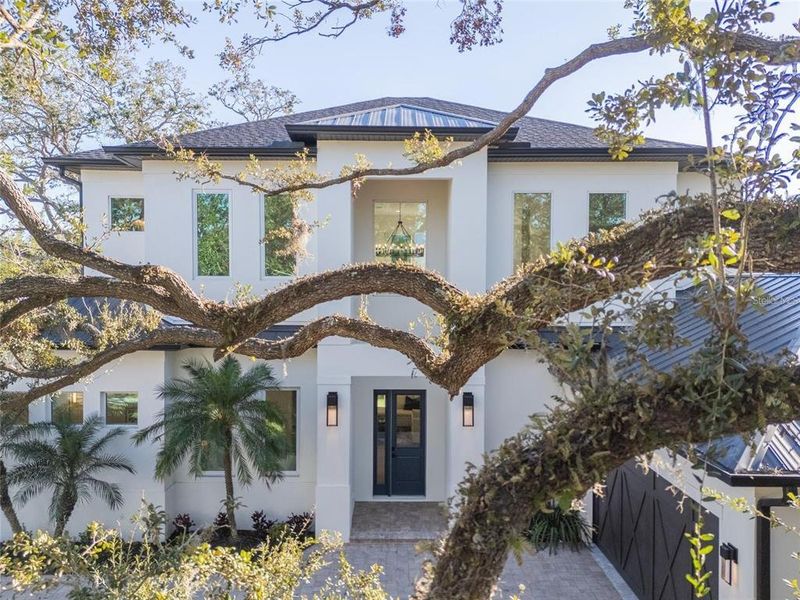 Front exterior of a new home in , Sarasota, FL, highlighting curb appeal (Image 24).