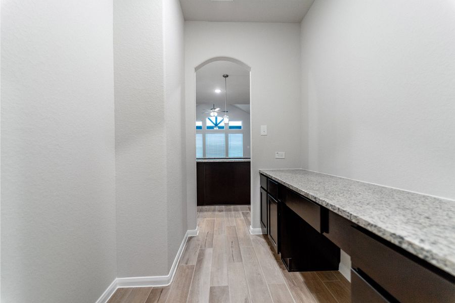 Furnished interior view inside a new home in Creekhaven, Iowa Colony (Image 6).