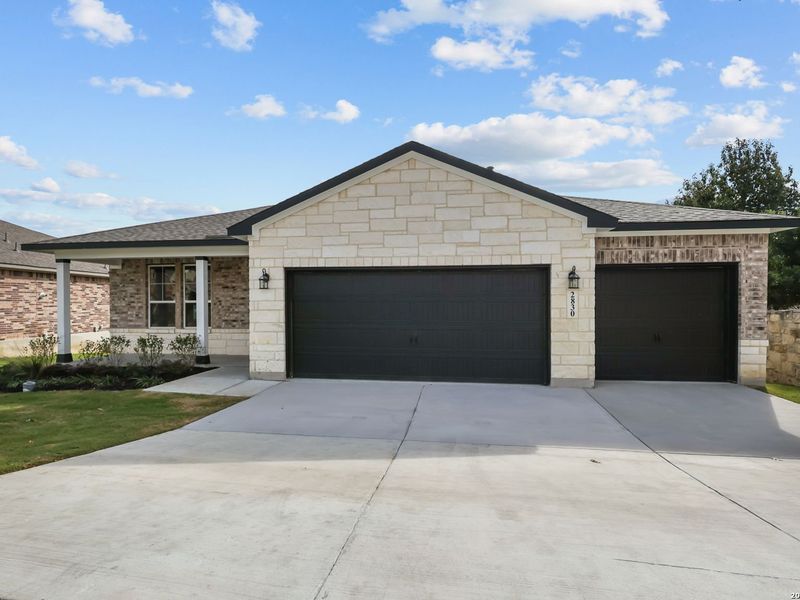 Front exterior of a new home in Ladera, San Antonio, TX, highlighting curb appeal (Image 24).