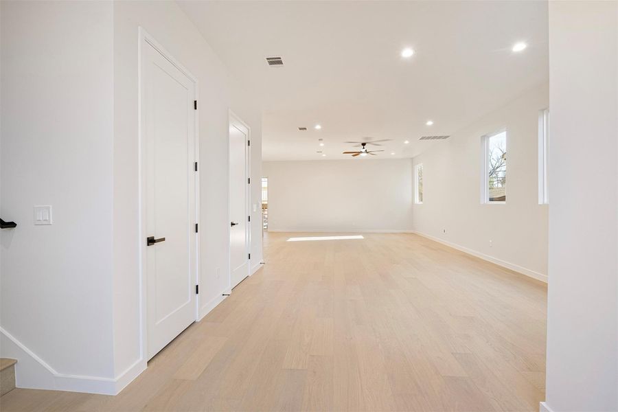 Empty room with light wood finished floors, recessed lighting, and a ceiling fan