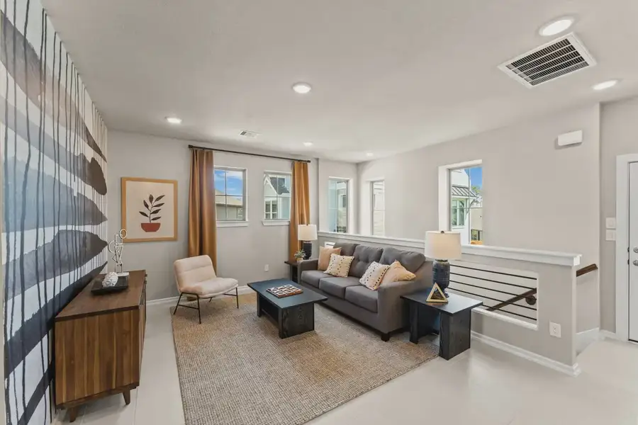 Representative furnished interior of a home built from the Capeside by Chesmar Homes in Meridiana Courtyard Collection, Manvel (Image 7).