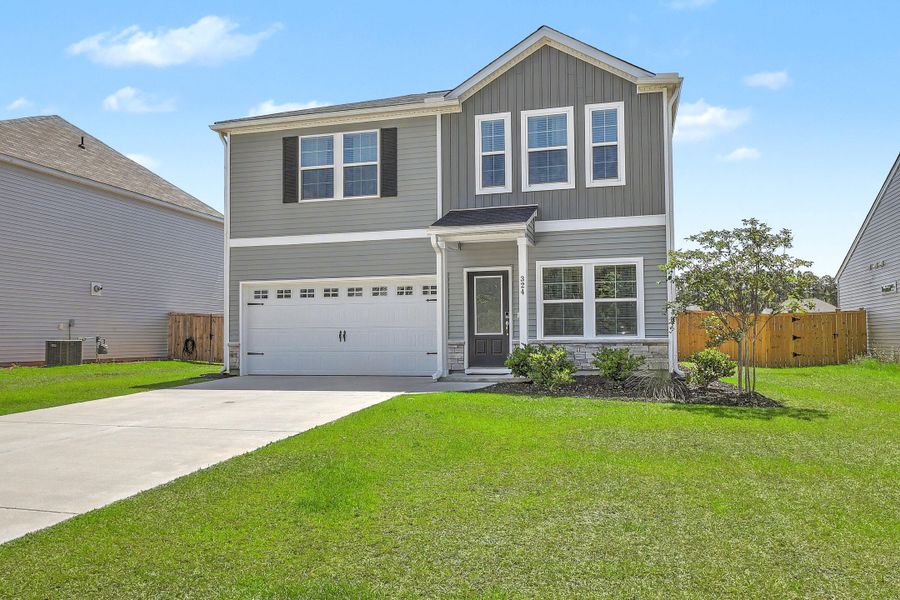 Front exterior of a new home in Petterson Meadows, Summerville, SC, highlighting curb appeal (Image 2). Front exterior of a new home in Petterson Meadows, Summerville, SC, highlighting curb appeal (Image 2).