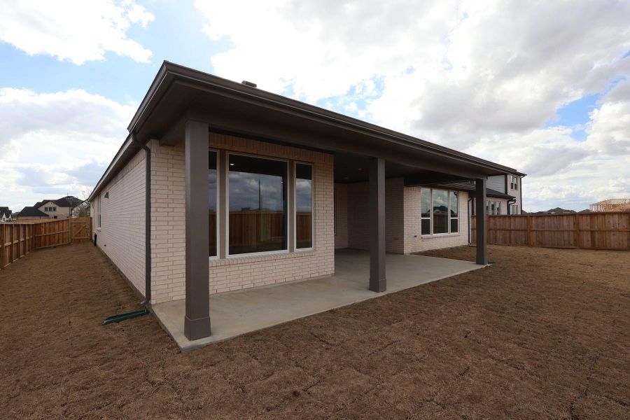 Exterior details and patio area of a home in Dunham Pointe, Cypress (Image 3).