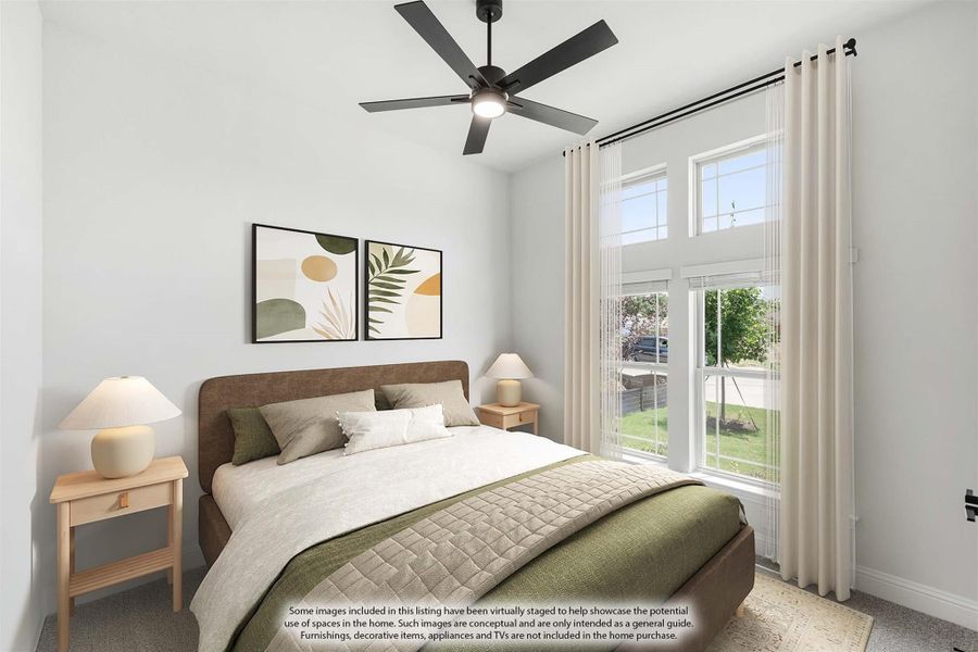 Bedroom with ceiling fan, large windows, and queen bed with green bedding and two nightstands