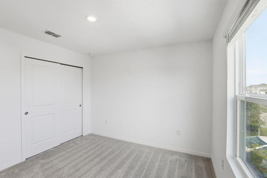 Spacious, unfurnished interior of a new home in Waterstone, Groveland (Image 18).