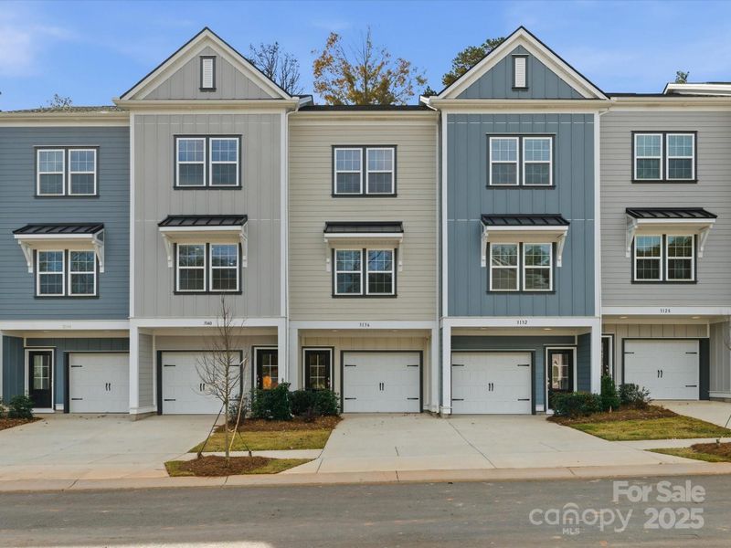 Front exterior of a new home in Sycamore Trail, Matthews, NC, highlighting curb appeal (Image 28).