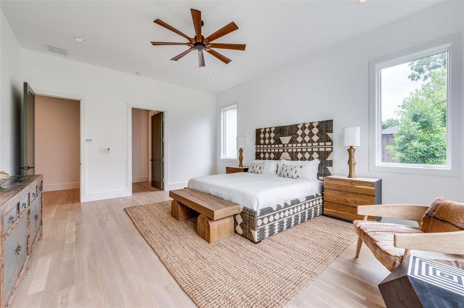 Bedroom with light hardwood / wood-style flooring and ceiling fan