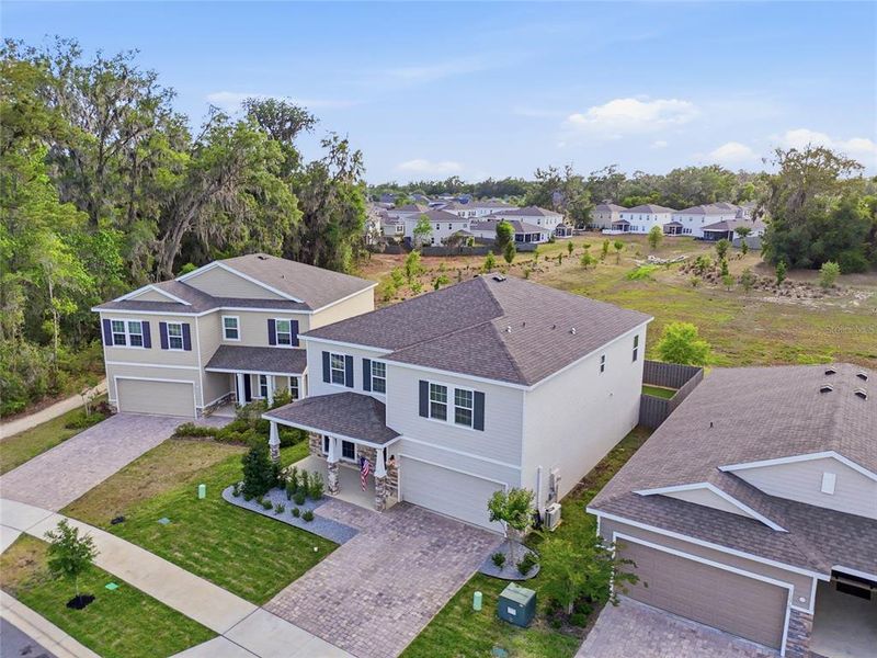 Front exterior of a new home in , Newberry, FL, highlighting curb appeal (Image 22).