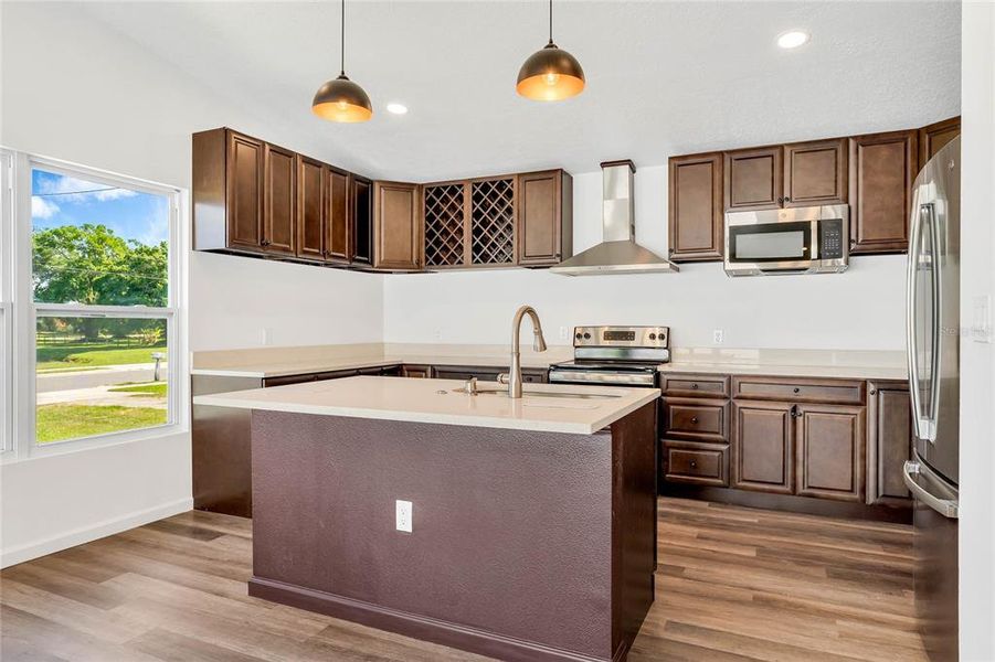 Kitchen w/ Island & Stainless Appliances