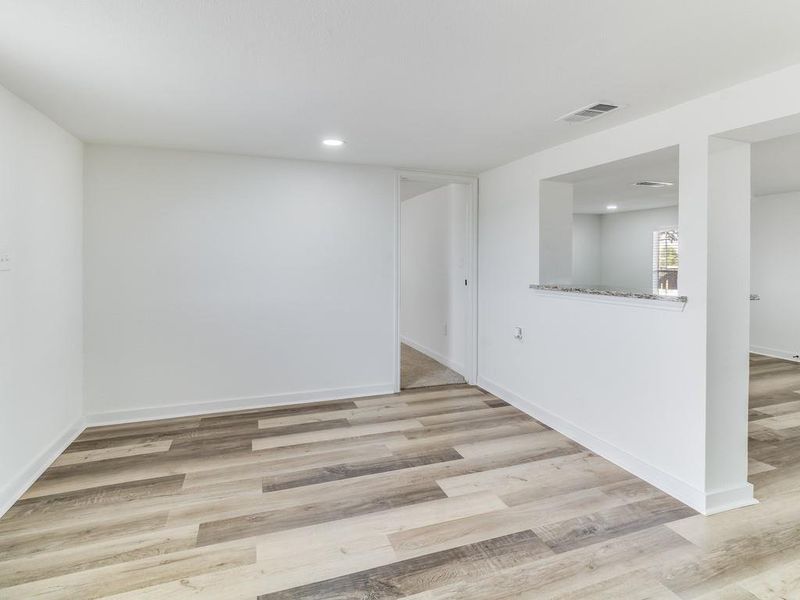 Spare room with light wood-style floors and recessed lighting Spare room with light wood-style floors and recessed lighting