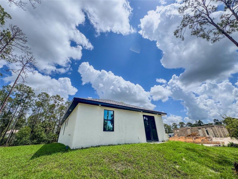 Exterior details and patio area of a home in , Lehigh Acres (Image 3).