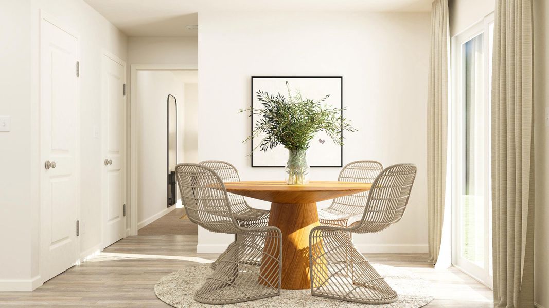 A dining room table with chairs.