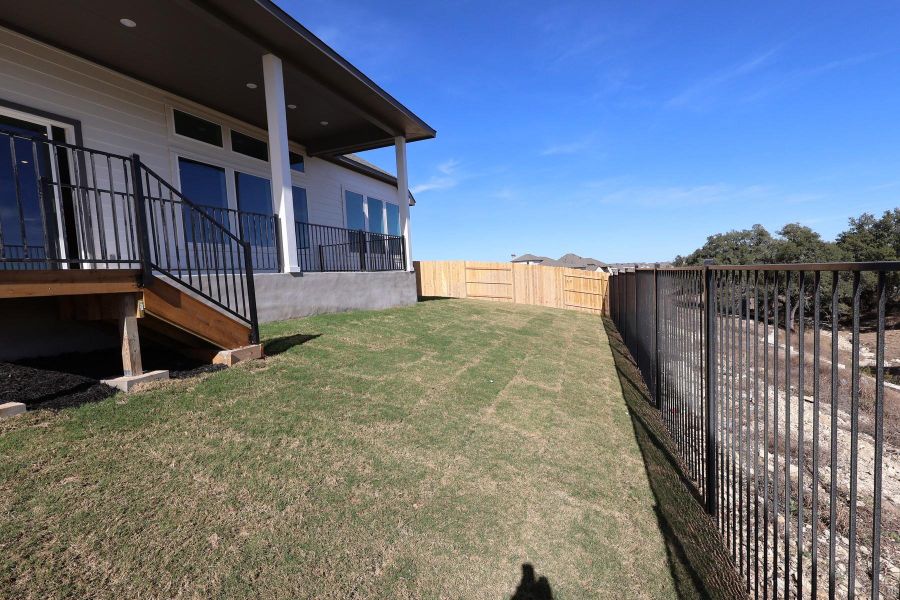 Exterior details and patio area of a home in Lariat, Liberty Hill (Image 20).
