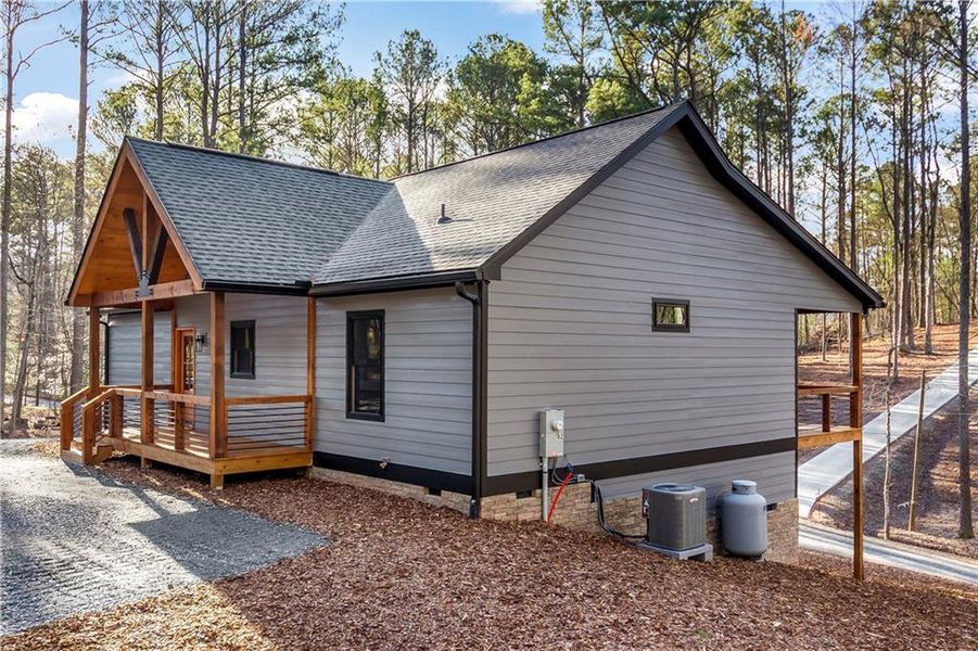 Exterior details and patio area of a home in , Ellijay (Image 24).