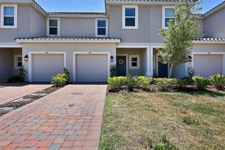 Front exterior of a new home in , Kissimmee, FL, highlighting curb appeal (Image 1). Front exterior of a new home in , Kissimmee, FL, highlighting curb appeal (Image 1).