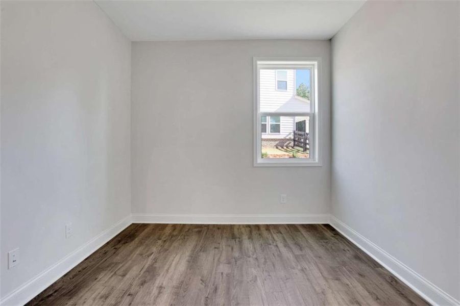 Spacious, unfurnished interior of a new home in The Paddocks at Doc Hughes, Buford (Image 28).