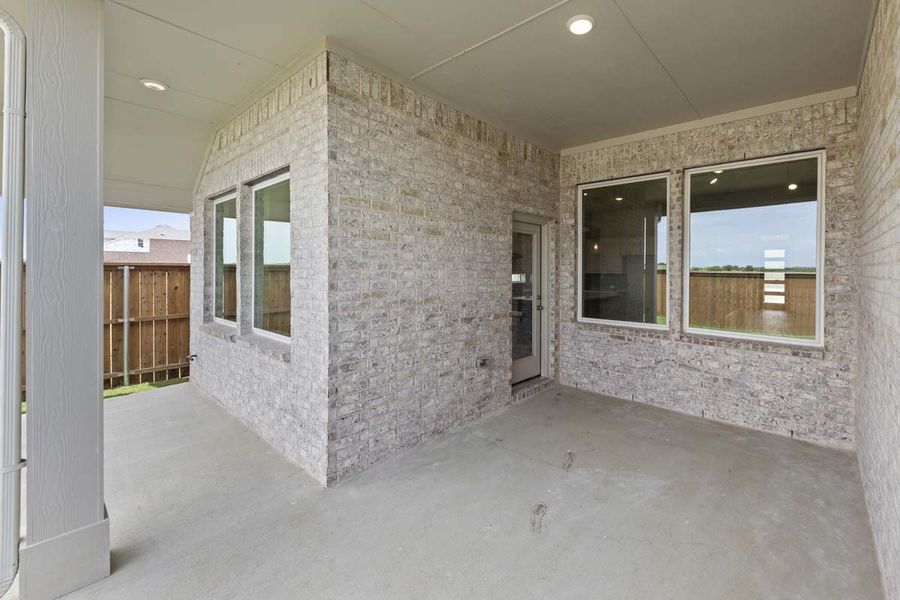 Exterior details and patio area of a home in Creekview Meadows, Pilot Point (Image 3).