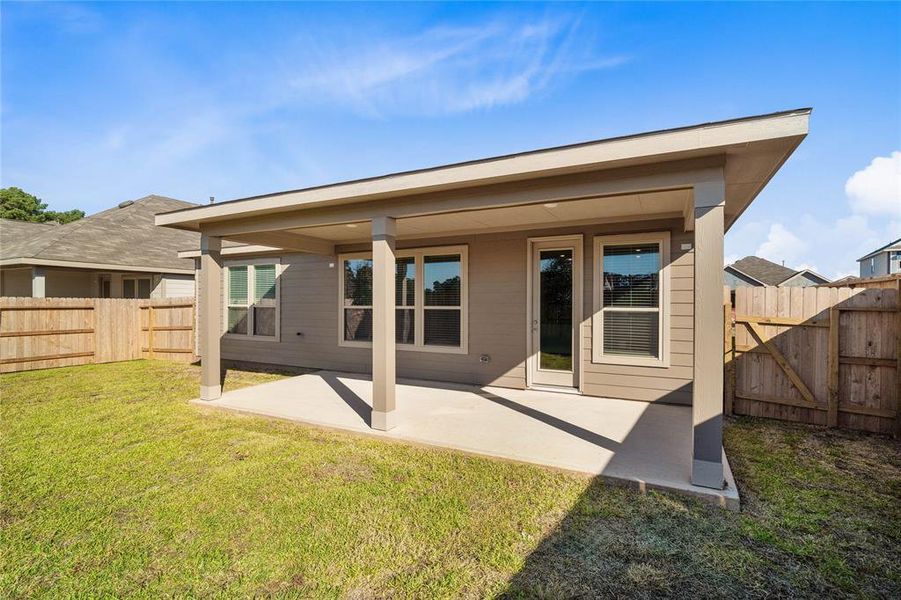 Come and see this spacious backyard with its beautiful extended covered patio. There is plenty of room for the kids to play and adults to relax!