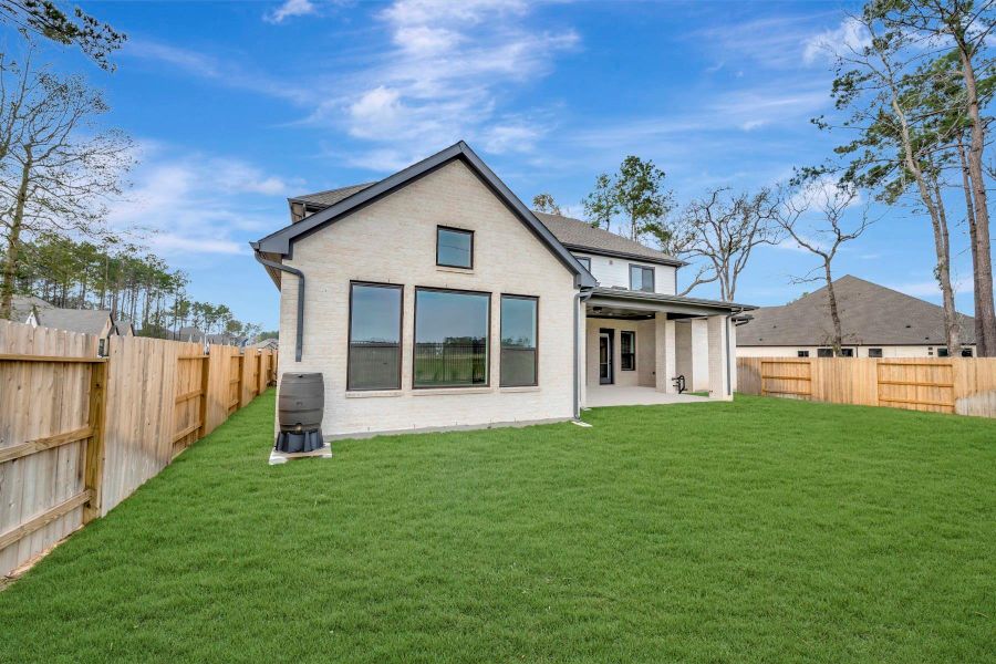 Exterior details and patio area of a home in ARTAVIA 65' Homesites, Conroe (Image 27).