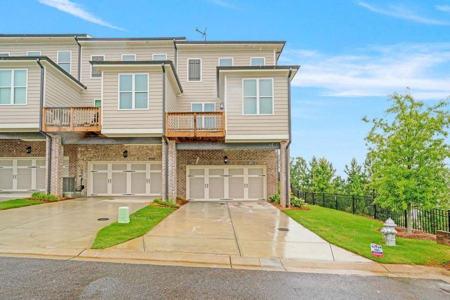 Front exterior of a new home in Millcroft Townhomes, Buford, GA, highlighting curb appeal (Image 20).