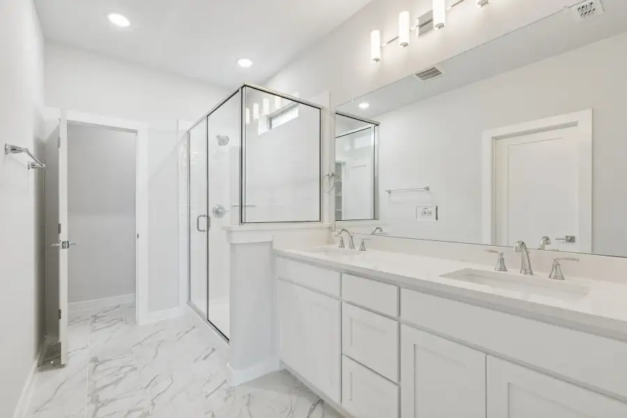 Primary Bathroom in the Stanley II home plan by Trophy Signature Homes – REPRESENTATIVE PHOTO