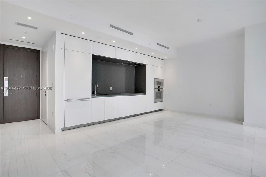Spacious, unfurnished interior of a new home in Aston Martin Residences, Miami (Image 9). Spacious, unfurnished interior of a new home in Aston Martin Residences, Miami (Image 9).