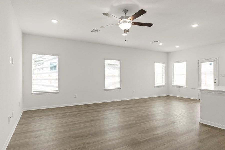 Unfurnished room with dark wood finished floors, recessed lighting, and ceiling fan