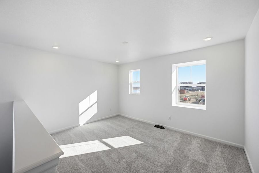 Spacious, unfurnished interior of a new home in Trailstone Town Collection, Arvada (Image 21).