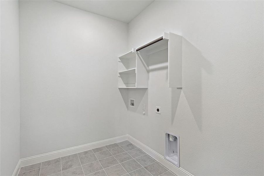 Washroom with hookup for a washing machine, hookup for a gas dryer, light tile patterned floors, and electric dryer hookup