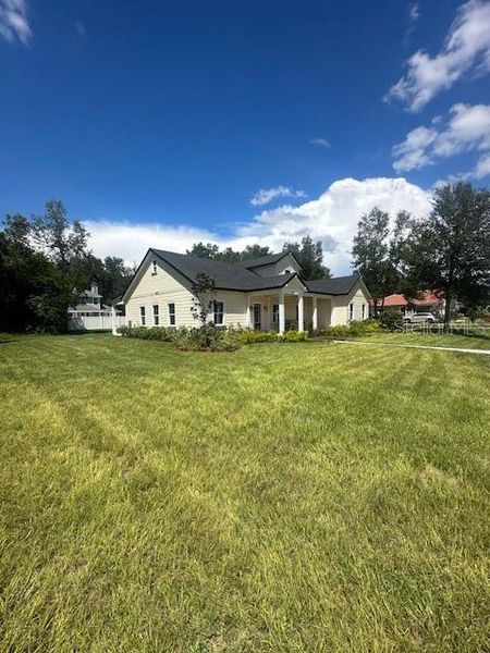Front exterior of a new home in , Lake Helen, FL, highlighting curb appeal (Image 29).
