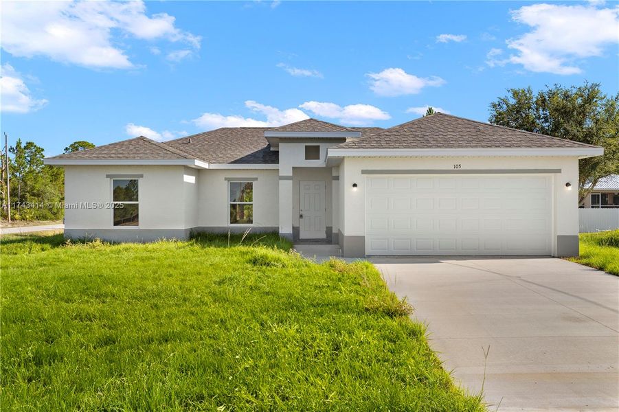 Front exterior of a new home in , Lehigh Acres, FL, highlighting curb appeal (Image 2). Front exterior of a new home in , Lehigh Acres, FL, highlighting curb appeal (Image 2).